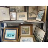 Two shelves of framed and glazed prints