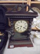 A good working mantel clock complete with key.