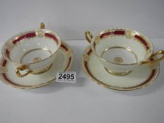 A pair of Shelley soup bowls with saucers.
