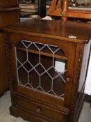 A dark oak display cabinet with leaded glass door, COLLECT ONLY