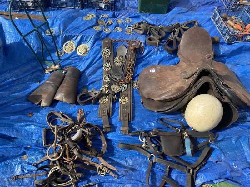 A good collection of horse related items including saddles, brasses etc