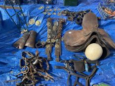 A good collection of horse related items including saddles, brasses etc