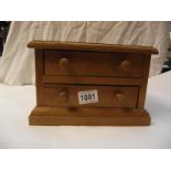 A small pine hand made wooden 2 drawer chest 13cm x 24cm x height 16cm