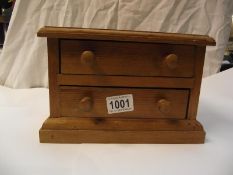 A small pine hand made wooden 2 drawer chest 13cm x 24cm x height 16cm