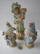 Two bisque porcelain busts and a figure.