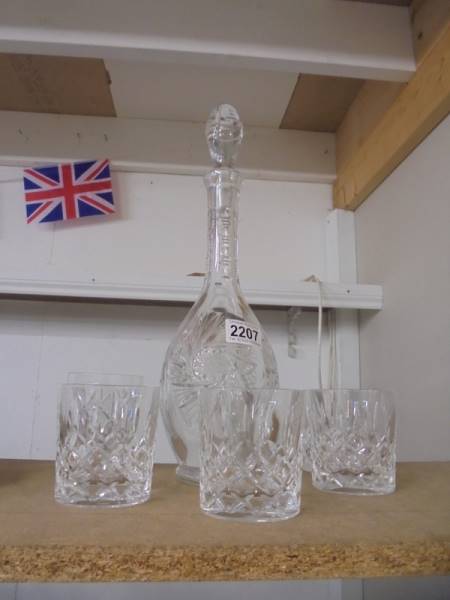 A cut glass decanter and five whisky tumblers.