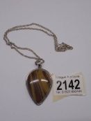 A golden Jasper stone pendant necklace, all silver.