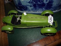 A green pressed steel model of a 1930's racing car Length 35cm