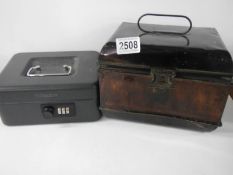 An old tin deed box and a tin combination box.