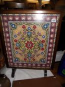 A wool work tapestry mahogany framed fire screen 55cm x 71cm COLLECT ONLY