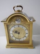 A heavy brass Swiss made clock. in working order.