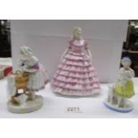 A Coalport Ladies of Fashion figurine 'First Dance', A match striker and another figure.