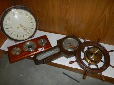 Three barometers and a clock.