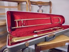 A La Fleur Boosey & Hawkes Alliance brass trombone in hard case.