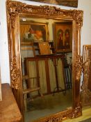 A large gilt framed bevel edged mirror, COLLECT ONLY.