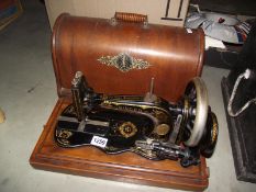A vintage cased Singer sewing machine COLLECT ONLY