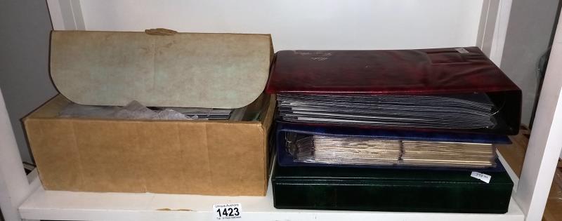 A large quantity of first day covers, stamps, postcards etc