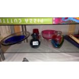 A quantity of art glass and a cranberry bowl on feet