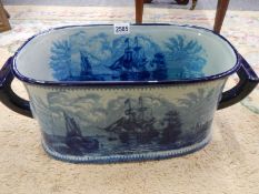 A blue and white foot bath featuring ships. COLLECT ONLY.