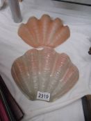 Two art deco pink glass clam shell Odeon wall light shades.