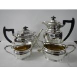 A four piece silver plate tea set.