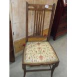 An Edwardian inlaid hall chair with art nouveau inlaid ovals