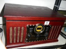 A 20th century record player / radio. COLLECT ONLY.