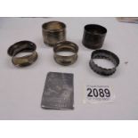 Four silver napkin rings (70 grams) and two other items.