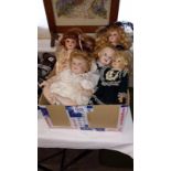 A box of 8 collectors Dolls
