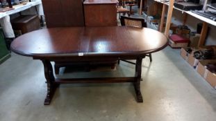A dark oak oval extending pub style dining table, COLLECT ONLY.