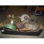 A box of vintage greenhouse oil lamp heaters, some with Duplex burners