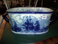 A large blue and white pottery footbath planter depicting ships COLLECT ONLY