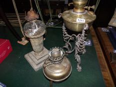 2 wrought iron framed oil lamps with brass fonts and 1 other