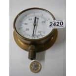 A combined pressure and vacuum gauge.