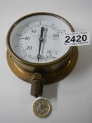 A combined pressure and vacuum gauge.