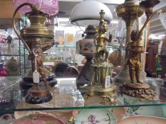Three figural table lamp bases.