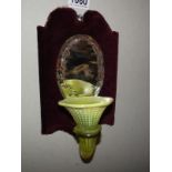 A Victorian wall hanging mirror with spill vase