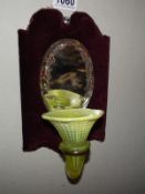 A Victorian wall hanging mirror with spill vase