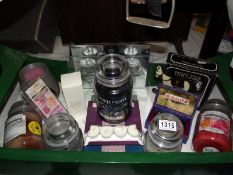 A good lot of candles, including Yankee, (used but lots of burning hours left) plus scented