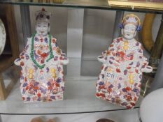 A pair of Chinese figures.