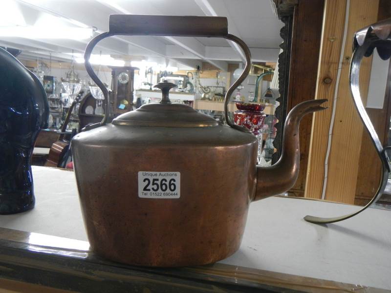 A Victorian copper kettle.