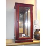 A table top mahogany display cabinet (no shelves) would maybe suit a doll. 26.5cm x 22.5cm, height