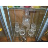 A cut glass decanter and six brandy goblets.