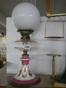 An early 20th century oil lamp on ceramic base with glass font, COLLECT ONLY.