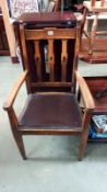 An arts and crafts oak carver chair with tulip cut out back slats, COLLECT ONLY