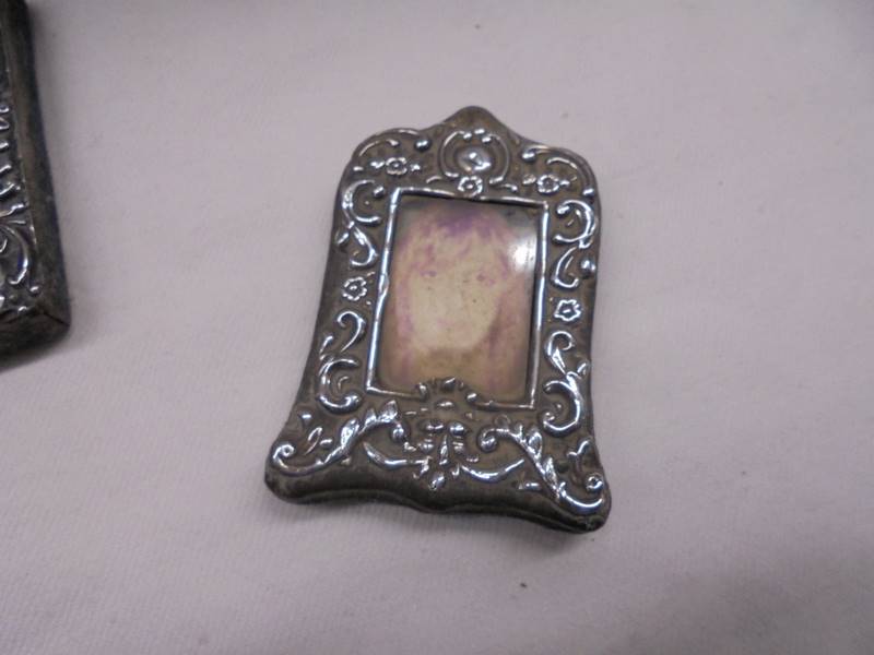 Three small silver photo frames and a silver pendant. - Image 3 of 5