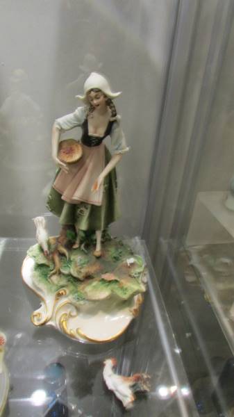 A Capo-di-monte figure of a girl feeding hens a/f and two other figures. - Image 3 of 3