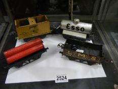 Four model railway trucks.