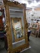 A tall gilt framed bevel edged mirror, 220 x 122cm, COLLECT ONLY.
