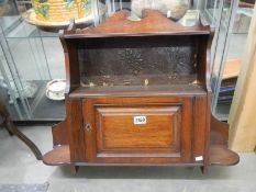 An early 20th century wall mounting cabinet. COLLECT ONLY.